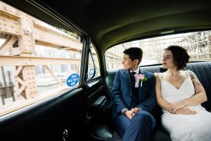 brooklyn checker cab wedding couple going over the bridge