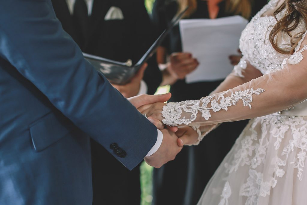 summer wedding central park brazilian couple holding hands at ladies pavillion