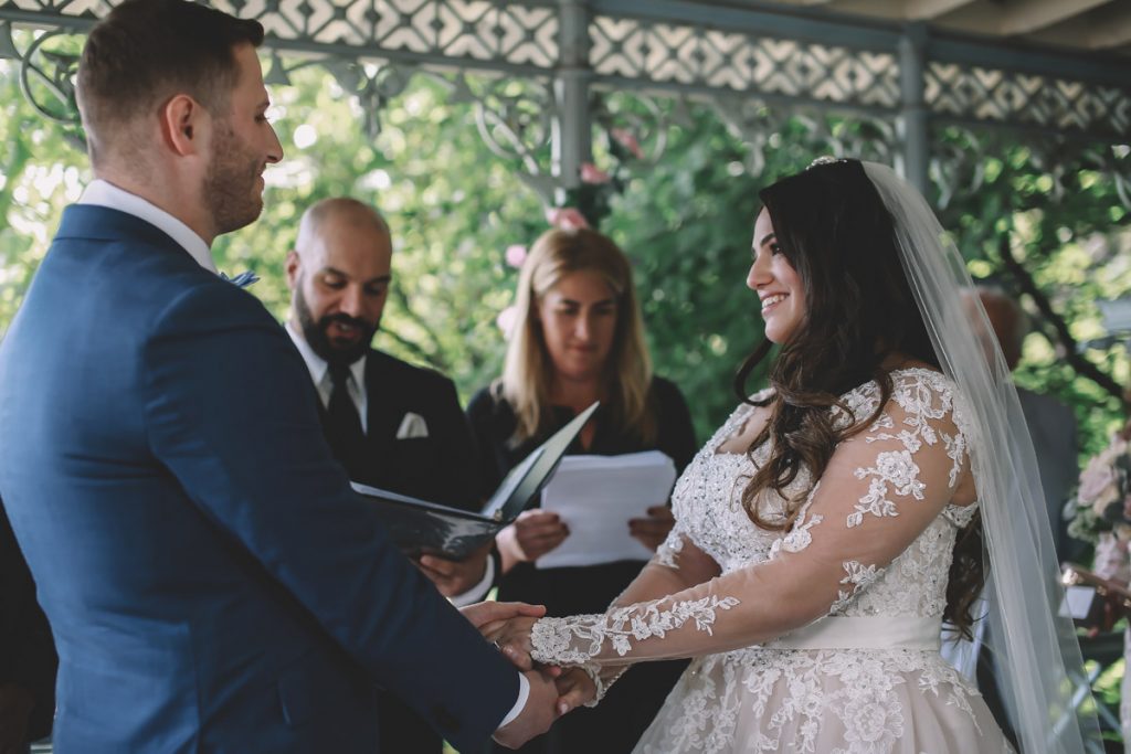 summer wedding central park ladies pavillion brazilian couple holding hands