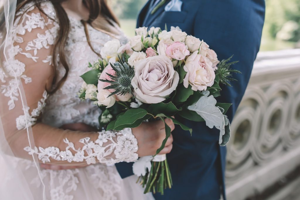 summer wedding central park on bow bridge brazilian couple with bridal bouquet